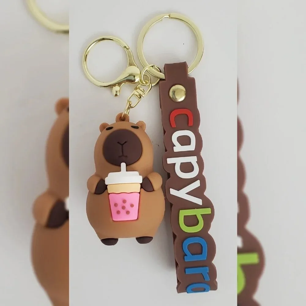 NWT CAPYBARA KEY CHAIN DIFFERENT ACTIONS 3D LOGO